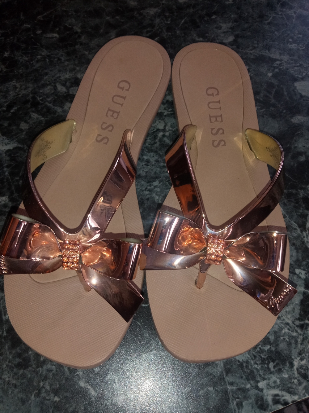Guess Women’s Rose Gold Metallic Bow Thong Sandals